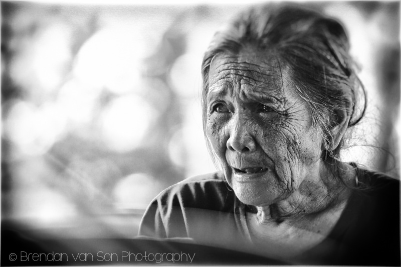 An older woman working in the food stalls in Bali